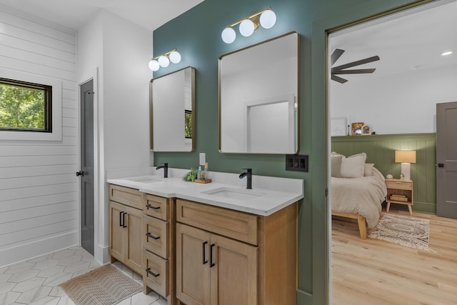 bathroom with vanity and hardwood / wood-style flooring