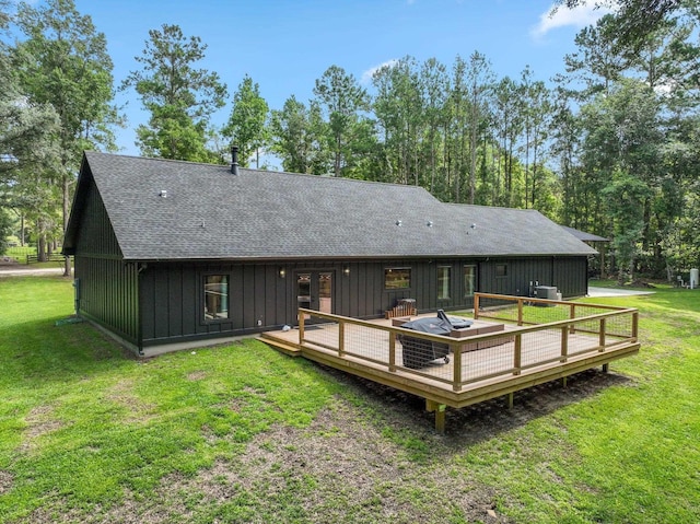 back of house with a deck, a yard, and central AC unit