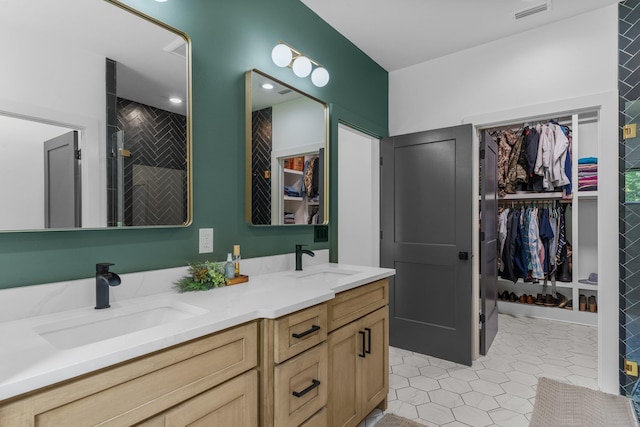 bathroom with walk in shower and vanity