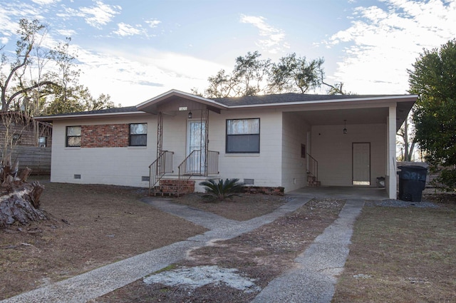 ranch-style home with a carport