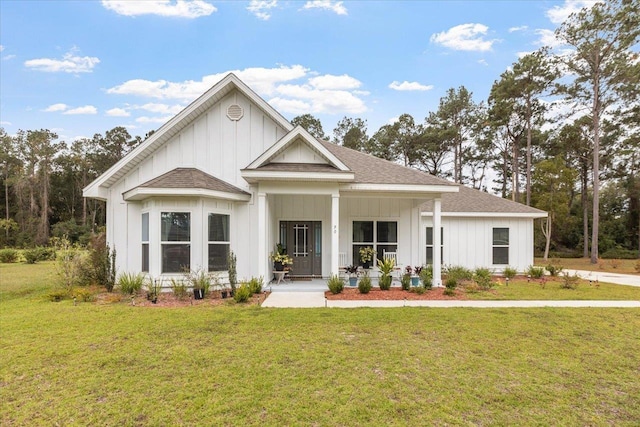view of front of home with a porch and a front lawn