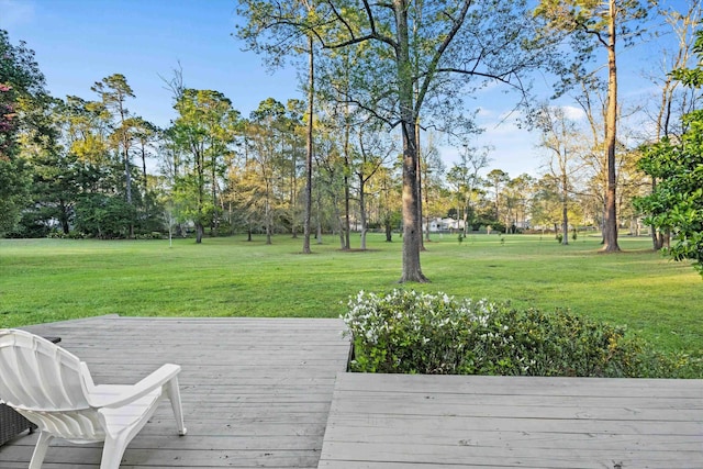 wooden terrace with a yard