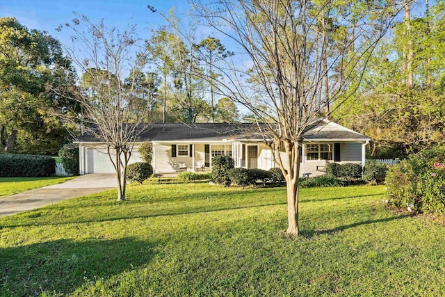 single story home featuring a porch, a front lawn, concrete driveway, and an attached garage