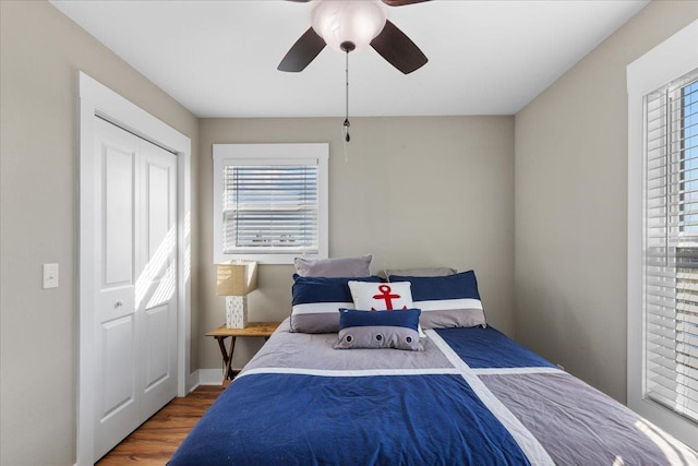 bedroom with ceiling fan and hardwood / wood-style floors