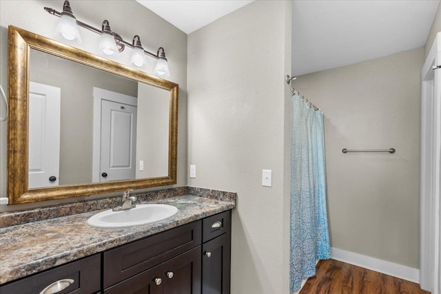 bathroom with vanity and hardwood / wood-style floors