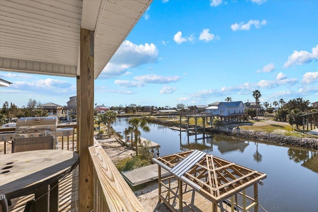 dock area featuring a water view