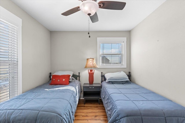 bedroom with hardwood / wood-style flooring and ceiling fan