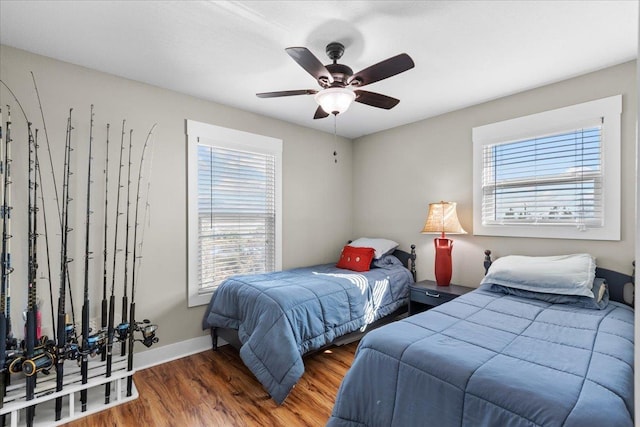 bedroom featuring ceiling fan and dark hardwood / wood-style flooring