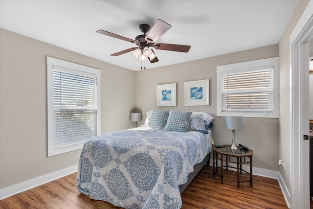 bedroom featuring hardwood / wood-style flooring and ceiling fan