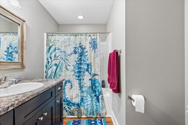 bathroom featuring vanity and a shower with curtain