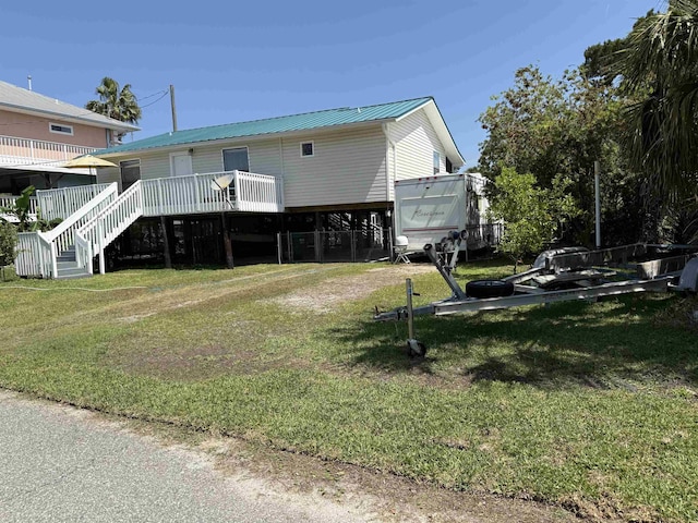 exterior space featuring a wooden deck and stairway