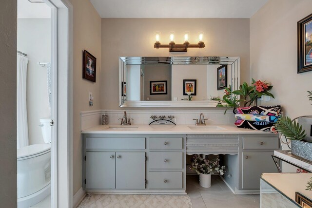 6509 Alan A Dale Trl, Tallahassee, FL 32309 - bathroom with double vanity and tile patterned flooring