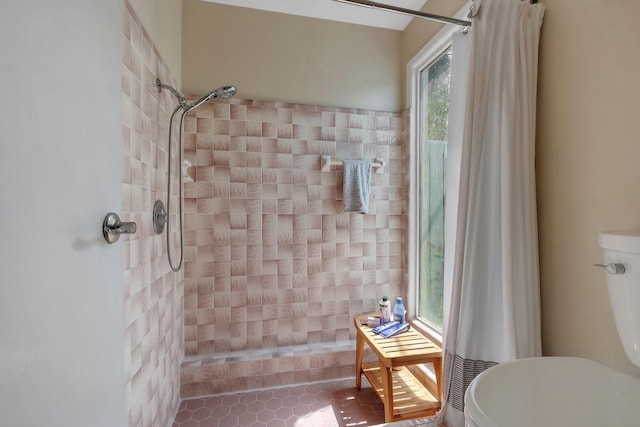 6509 Alan A Dale Trl, Tallahassee, FL 32309 - bathroom featuring a tile shower and tile patterned floors