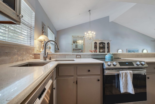 6509 Alan A Dale Trl, Tallahassee, FL 32309 - kitchen featuring stainless steel appliances, vaulted ceiling, a chandelier, tasteful backsplash, and hanging light fixtures
