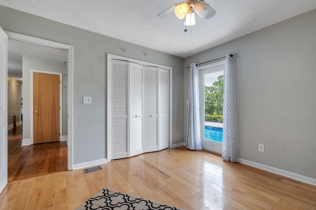 6509 Alan A Dale Trl, Tallahassee, FL 32309 - unfurnished bedroom featuring light wood-type flooring, a closet, a ceiling fan, and access to outside