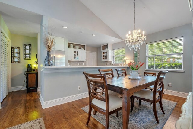 6509 Alan A Dale Trl, Tallahassee, FL 32309 - dining area featuring a chandelier, wood finished floors, recessed lighting, and lofted ceiling