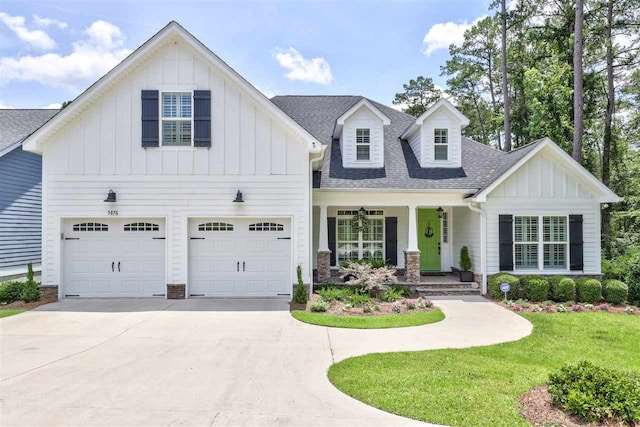 view of front of property with a garage and a front yard