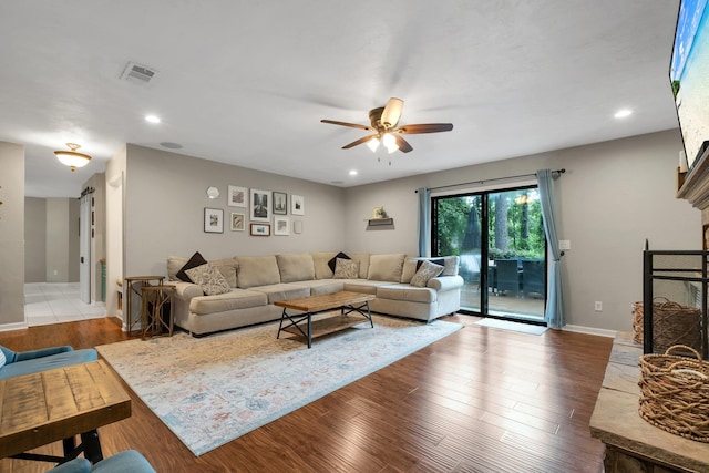 3412 Edgemont Trl, Tallahassee, FL 32312 - living area with ceiling fan, wood finished floors, a fireplace with raised hearth, and recessed lighting