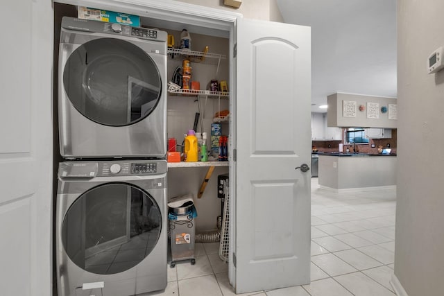 3412 Edgemont Trl, Tallahassee, FL 32312 - laundry area with stacked washer / dryer and tile patterned flooring