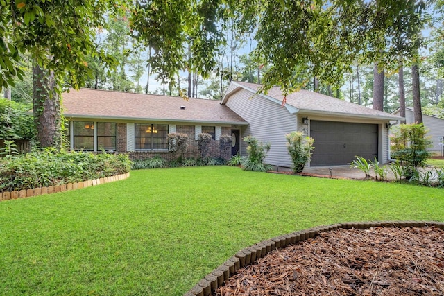 3412 Edgemont Trl, Tallahassee, FL 32312 - view of front of property with a front lawn, a garage, a shingled roof, and driveway
