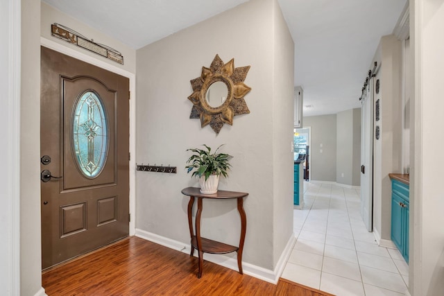 3412 Edgemont Trl, Tallahassee, FL 32312 - foyer entrance featuring plenty of natural light, light wood-style flooring, and a barn door
