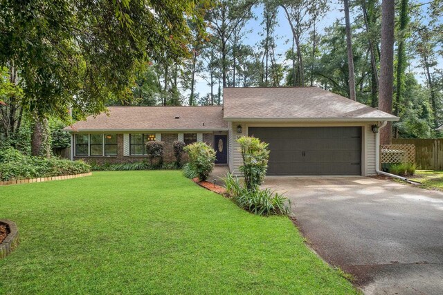 3412 Edgemont Trl, Tallahassee, FL 32312 - ranch-style home featuring asphalt driveway and a garage