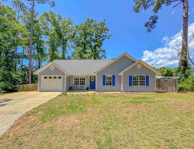 single story home with fence, an attached garage, driveway, and a front yard