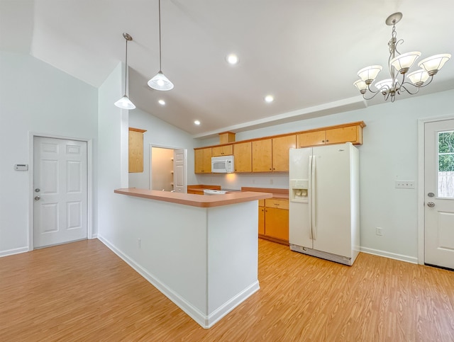 kitchen with lofted ceiling, white appliances, light wood-type flooring, light countertops, and a notable chandelier