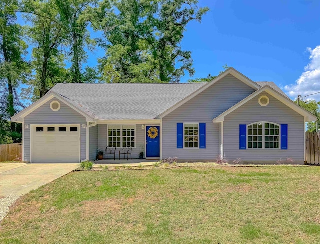 single story home featuring driveway, a front yard, fence, an attached garage, and a shingled roof
