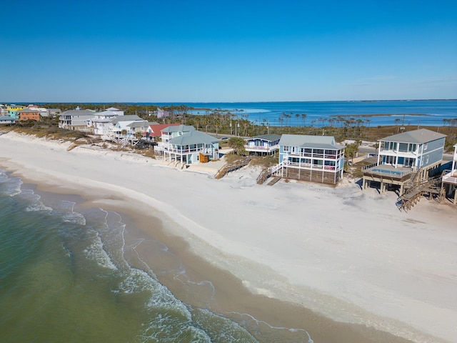 birds eye view of property featuring a view of the beach and a water view