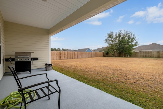 view of patio featuring a grill