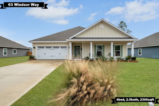 craftsman inspired home with a garage and a front lawn