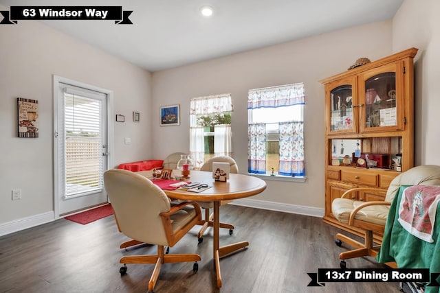 dining room with dark hardwood / wood-style floors