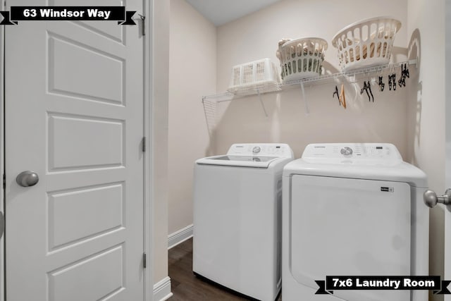 washroom featuring washer and dryer and dark hardwood / wood-style flooring