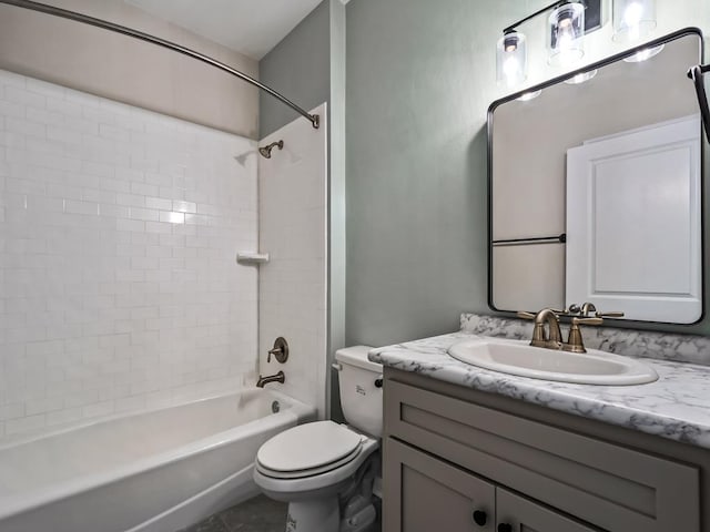 full bathroom with tiled shower / bath combo, vanity, and toilet