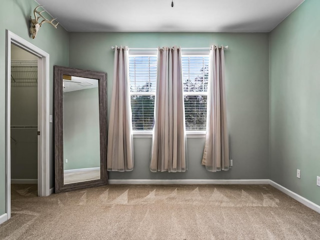 empty room featuring light colored carpet