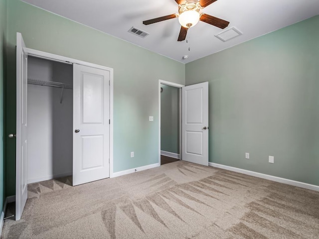 unfurnished bedroom featuring carpet flooring, ceiling fan, and a closet