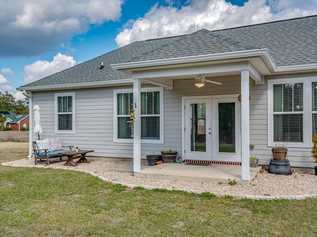 rear view of house featuring french doors, a patio, ceiling fan, and a lawn