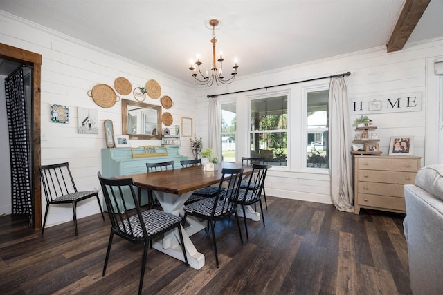 dining space with dark wood-type flooring, a notable chandelier, and beam ceiling