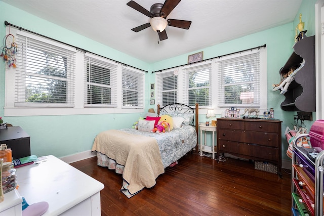 bedroom featuring dark hardwood / wood-style floors and ceiling fan