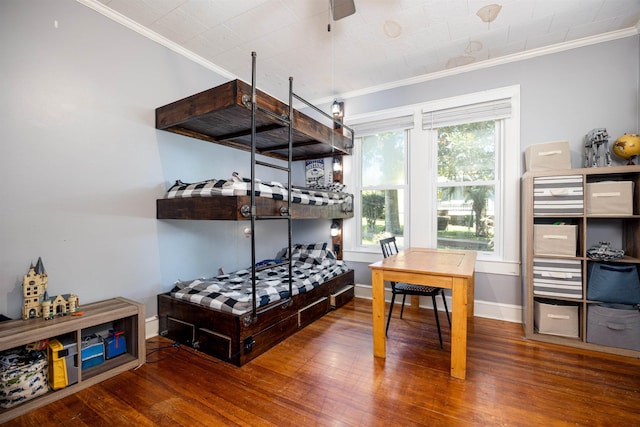 bedroom with crown molding and wood-type flooring