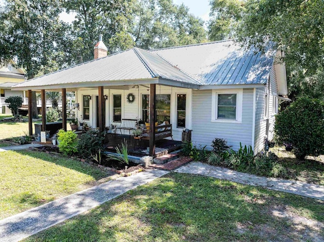 bungalow featuring a front yard and a porch