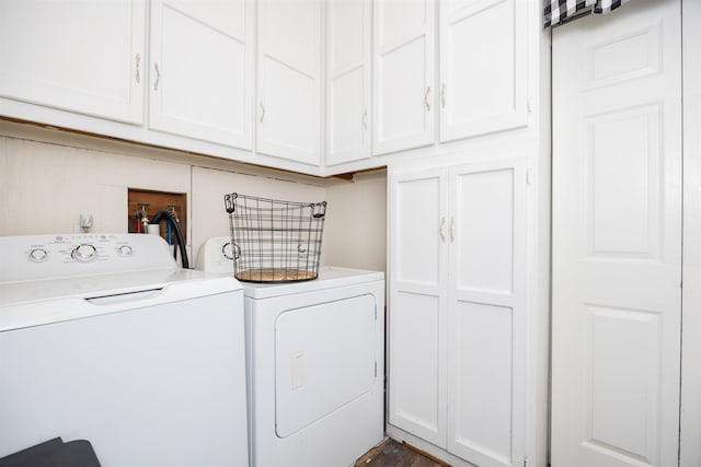 laundry area featuring cabinets and separate washer and dryer