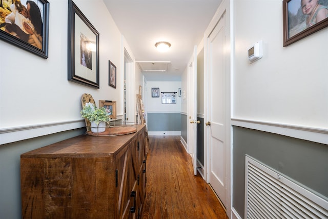 hall with dark hardwood / wood-style flooring