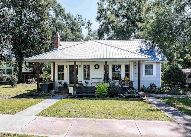 bungalow-style home with a porch and a front lawn