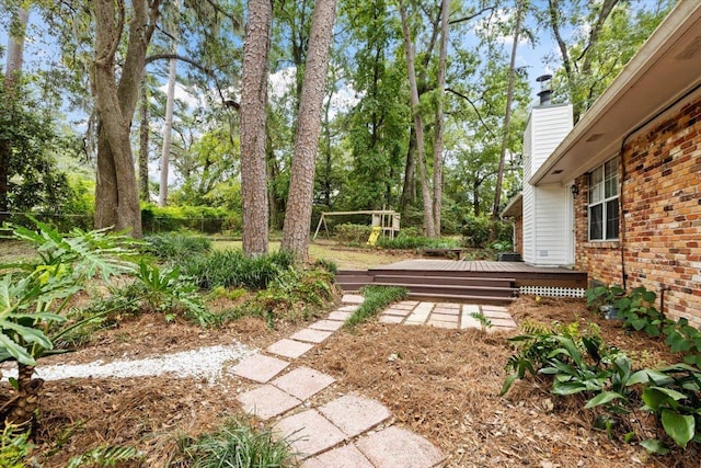 view of yard featuring a wooden deck