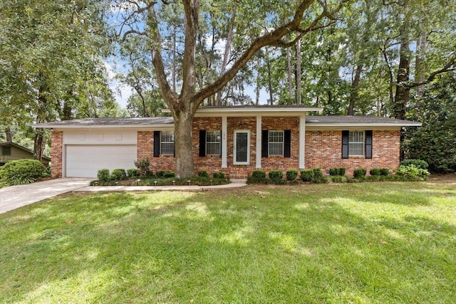 view of front of property with a garage and a front yard