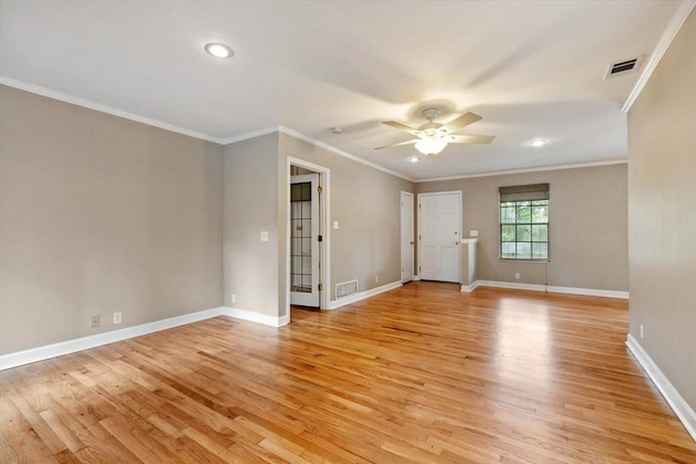 spare room featuring ceiling fan, ornamental molding, and light hardwood / wood-style flooring