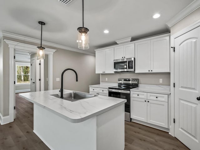 70 Beeler Rd, Crawfordville, FL 32327 - kitchen with stainless steel appliances, crown molding, dark wood-type flooring, white cabinets, and hanging light fixtures