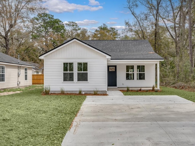 70 Beeler Rd, Crawfordville, FL 32327 - view of front facade with a shingled roof and a porch